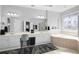 Elegant bathroom with double vanity, soaking tub, and natural light at 1286 Creekside Se Ter, Smyrna, GA 30082