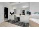 Bathroom featuring double sinks, white cabinetry, and a large mirror at 1286 Creekside Se Ter, Smyrna, GA 30082