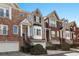 Charming townhome with brick facade, bay window, a one car garage, and manicured landscaping at 1286 Creekside Se Ter, Smyrna, GA 30082