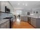 Modern kitchen with granite countertops, stainless steel appliances, and stylish backsplash; perfect for cooking and entertaining at 1286 Creekside Se Ter, Smyrna, GA 30082