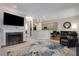 Open-concept living area with fireplace, stylish decor, and seamless flow to the kitchen at 1286 Creekside Se Ter, Smyrna, GA 30082