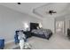 Bright and spacious main bedroom featuring a seating area, tray ceiling and plush carpet at 1286 Creekside Se Ter, Smyrna, GA 30082