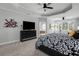 Elegant primary bedroom with tray ceilings, plush carpet and en suite bathroom access at 1286 Creekside Se Ter, Smyrna, GA 30082