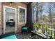 Covered patio features outdoor seating, brick walls, and a view of the trees at 1286 Creekside Se Ter, Smyrna, GA 30082