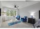 Comfortable sitting area in bedroom with plush chairs, glass table, and bright windows at 1286 Creekside Se Ter, Smyrna, GA 30082