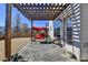 A covered backyard patio with a red swing and a spacious, fenced-in yard at 1465 Forest Brook Trl, Cumming, GA 30041