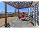 A covered backyard patio with a red swing and a spacious, fenced-in yard at 1465 Forest Brook Trl, Cumming, GA 30041
