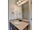 Bathroom with granite countertop, undermount sink, and large mirror at 1465 Forest Brook Trl, Cumming, GA 30041
