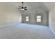 Spacious bedroom featuring a vaulted ceiling, neutral walls and plush carpeting at 1465 Forest Brook Trl, Cumming, GA 30041