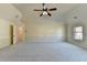 Spacious bedroom with vaulted ceiling, neutral carpet and paint, plus ample lighting for relaxation at 1465 Forest Brook Trl, Cumming, GA 30041