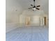 Open bedroom with vaulted ceiling, neutral carpet and paint, and multiple doorways at 1465 Forest Brook Trl, Cumming, GA 30041
