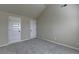 Bedroom featuring neutral walls, carpet and two white paneled doors allowing customization at 1465 Forest Brook Trl, Cumming, GA 30041