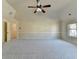 Expansive bedroom with a vaulted ceiling, light-colored walls, and soft carpeting at 1465 Forest Brook Trl, Cumming, GA 30041