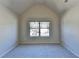 Bedroom showcasing a window that offers natural light and a view of the outdoors at 1465 Forest Brook Trl, Cumming, GA 30041