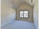 Bright bedroom featuring a window, neutral carpet and walls creating a soothing retreat at 1465 Forest Brook Trl, Cumming, GA 30041