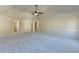 Vast bedroom with a vaulted ceiling, light-colored walls, and soft carpeting at 1465 Forest Brook Trl, Cumming, GA 30041