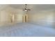 Expansive bedroom with vaulted ceiling, neutral carpet and paint, and multiple entryways at 1465 Forest Brook Trl, Cumming, GA 30041