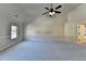 Large bedroom with neutral carpet, paint, vaulted ceiling and fan, providing a calm and spacious atmosphere at 1465 Forest Brook Trl, Cumming, GA 30041