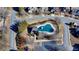 Aerial view of the neighborhood pool and cabana with mature landscaping and ample parking at 1465 Forest Brook Trl, Cumming, GA 30041