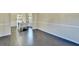 The Dining Area features hardwood floors, an open layout and decorative molding detail on the lower part of the walls at 1465 Forest Brook Trl, Cumming, GA 30041