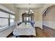 Dining Room with coffered ceilings, decorative wall trim, a window with wood blinds and an arched entry to another room at 1465 Forest Brook Trl, Cumming, GA 30041