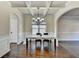 Dining room featuring coffered ceilings and hardwood floors at 1465 Forest Brook Trl, Cumming, GA 30041