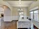 Dining room with hardwood floors, coffered ceilings, and view of fireplace in adjacent room at 1465 Forest Brook Trl, Cumming, GA 30041
