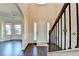 Bright foyer with high ceilings, dark wood floors, and traditional wainscoting at 1465 Forest Brook Trl, Cumming, GA 30041