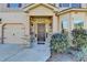 Inviting entrance with a stone facade, covered porch, and meticulously landscaped surroundings at 1465 Forest Brook Trl, Cumming, GA 30041