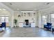 Bright home office with hardwood floors, custom built-in shelving, and ample workspace at 1465 Forest Brook Trl, Cumming, GA 30041