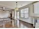 Bright kitchen with hardwood floors looks into a spacious seating area at 1465 Forest Brook Trl, Cumming, GA 30041