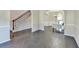 The Living Area features decorative molding on the walls, hardwood floors, and an arched doorway leading to the Dining Area at 1465 Forest Brook Trl, Cumming, GA 30041