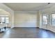 Spacious living room with hardwood floors, arched entryways, and abundant natural light at 1465 Forest Brook Trl, Cumming, GA 30041