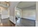 Spacious living room with hardwood floors, arched entryways, and abundant natural light at 1465 Forest Brook Trl, Cumming, GA 30041
