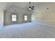 Spacious primary bedroom with vaulted ceiling and large windows at 1465 Forest Brook Trl, Cumming, GA 30041