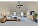 Serene main bedroom features high ceiling, carpeting, and neutral decor at 1465 Forest Brook Trl, Cumming, GA 30041