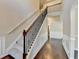 Beautiful staircase with carpeted treads, decorative iron balusters, and a view of the hallway at 1465 Forest Brook Trl, Cumming, GA 30041