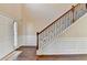 Elegant foyer featuring hardwood floors, staircase with decorative iron balusters at 1465 Forest Brook Trl, Cumming, GA 30041