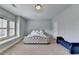 Bedroom featuring neutral walls, carpet, a tufted day bed, and a window with shutters at 875 Olmsted Ln, Duluth, GA 30097