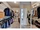 Walk in closet featuring ample hanging space and shelving at 875 Olmsted Ln, Duluth, GA 30097