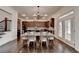 Dining area with hardwood floors and direct access to the kitchen at 875 Olmsted Ln, Duluth, GA 30097