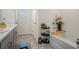 Modern bathroom featuring a bathtub and decorative shelves with plants at 1026 King Iron Dr, Lawrenceville, GA 30045