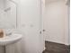 Clean powder room features a pedestal sink and modern fixtures at 1026 King Iron Dr, Lawrenceville, GA 30045
