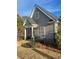 Charming single-story home featuring gray siding, stone accents, and well-maintained landscaping at 1026 King Iron Dr, Lawrenceville, GA 30045