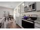 Bright kitchen features granite counters, stainless steel appliances, and a dining area with outdoor access at 1026 King Iron Dr, Lawrenceville, GA 30045