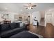 Open-concept living room with hardwood floors and lots of natural light at 1026 King Iron Dr, Lawrenceville, GA 30045
