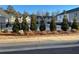 Community pool surrounded by evergreen trees at 1026 King Iron Dr, Lawrenceville, GA 30045
