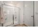 Bright shower with glass doors and tiled floors at 1026 King Iron Dr, Lawrenceville, GA 30045