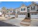 Street view of townhomes with garages and landscaping at 1026 King Iron Dr, Lawrenceville, GA 30045