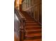 Elegant dark wood staircase with detailed carvings, offering a timeless and sophisticated design element at 1585 S Ponce De Leon Avenue #M3, Atlanta, GA 30307